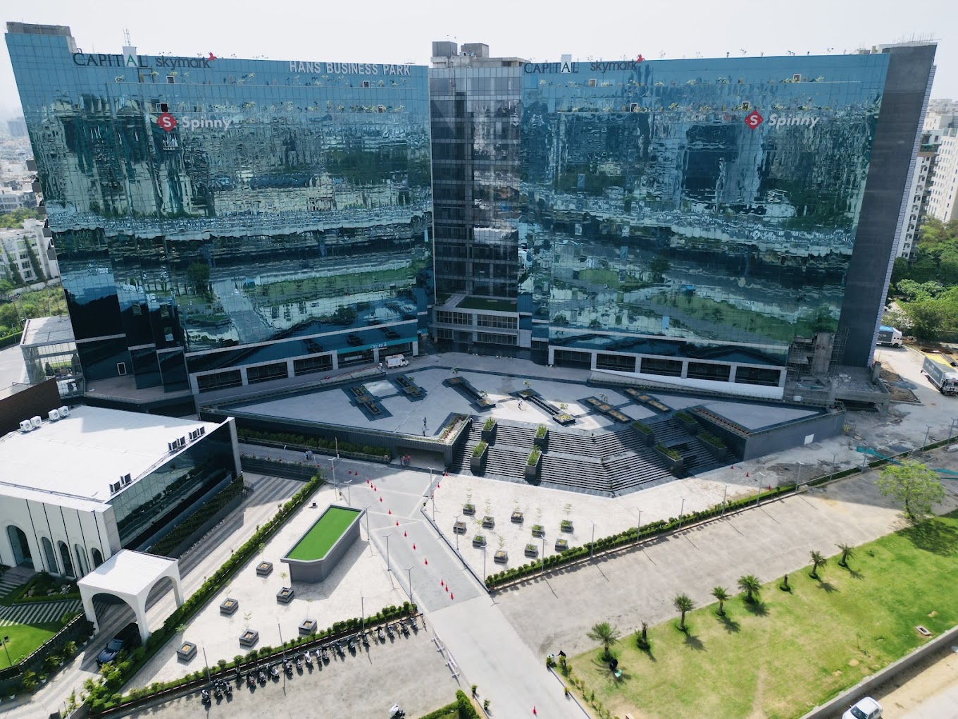 Aerial view of Hans Business Park with glass-fronted commercial buildings and an arrival plaza